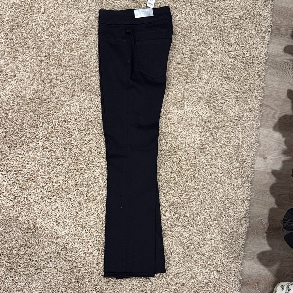Chico's Black pull on slim boot cut Denim. Size 4 regular. New with tags